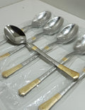 Set of silver spoons with gold accents 