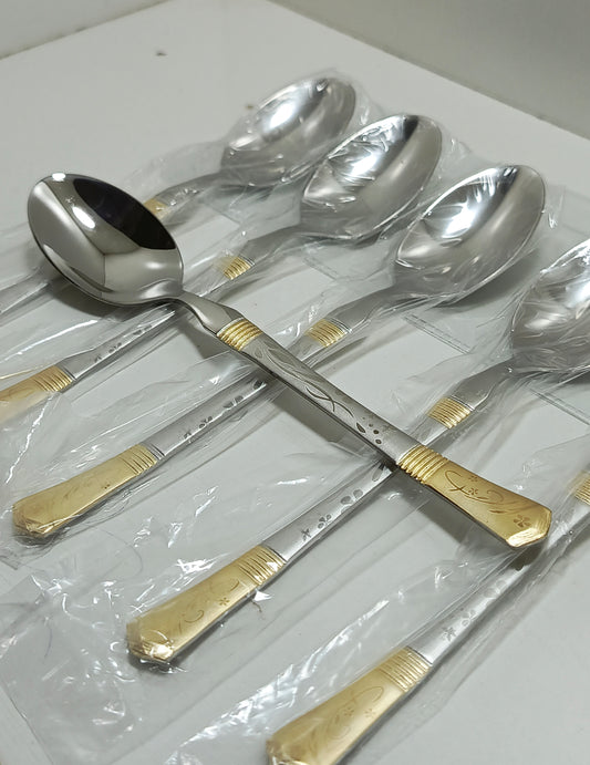 Set of silver spoons with gold accents 
