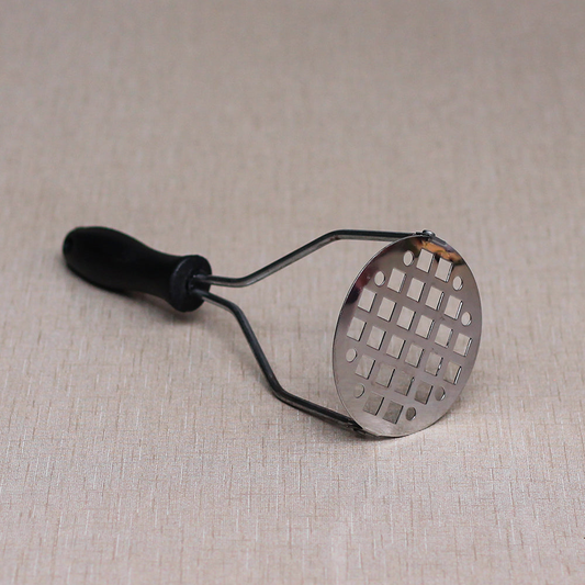 Potato masher with plastic handle and square box hole